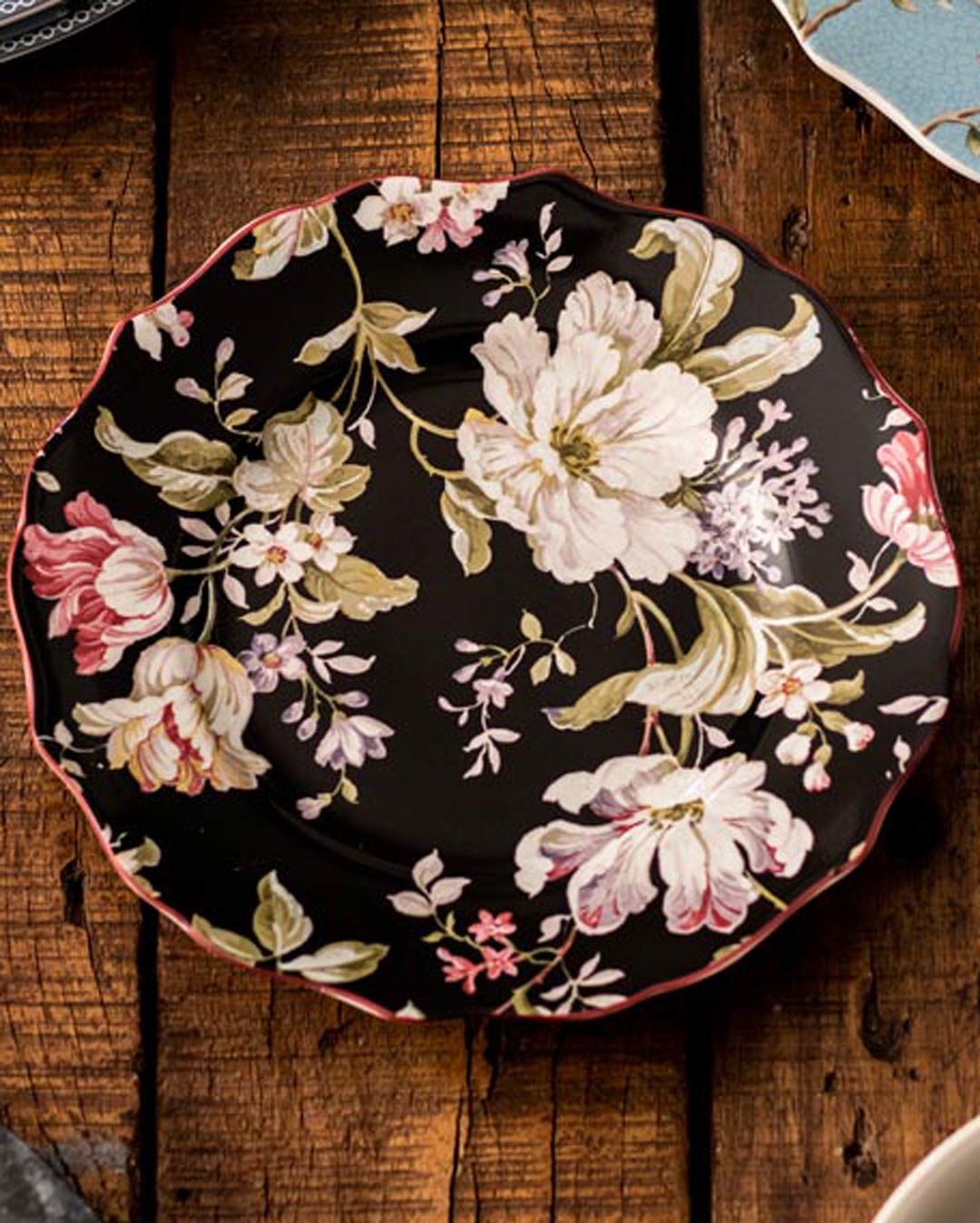 Close up Elegant Gisela Black Quarter Plate featuring a timeless floral pattern on a sleek black background, ideal for sophisticated dining and accentuating any meal with its classic design.