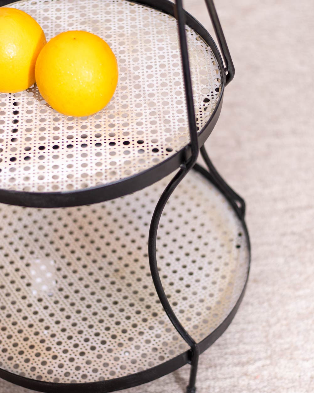 Provence 2-Tier fruit and assortments Basket, highlighting the quality carbon structural steel, suitable for storing a variety of kitchen essentials.