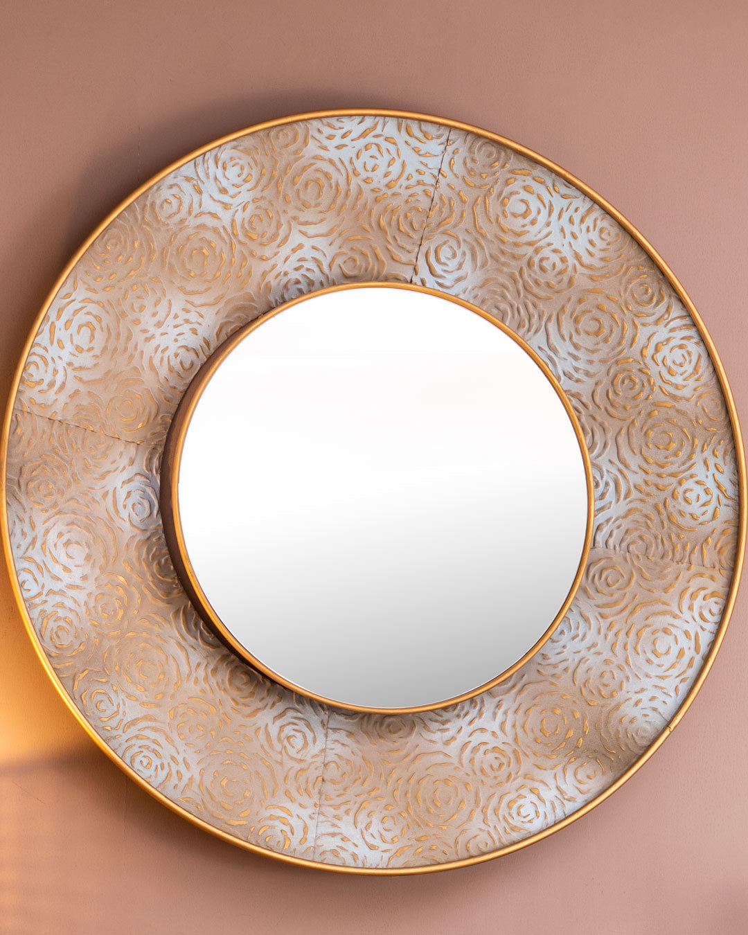 Detailed view of a Moroccan filigree wall mirror, highlighting the ornate distressed metal work, which adds a rustic yet sophisticated charm to any interior design setting.