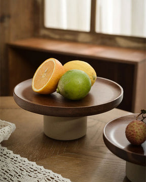 Versatile Wooden Rustic Round Cake Stand, shown with a selection of fruits, perfect for rustic or farmhouse-style kitchen decor.
