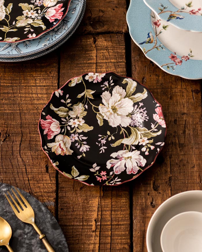 Elegant Gisela Black Quarter Plate featuring a timeless floral pattern on a sleek black background, ideal for sophisticated dining and accentuating any meal with its classic design.