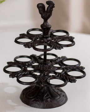Classic cast iron bird feeder with a rooster figure atop, showcasing traditional design and craftsmanship.