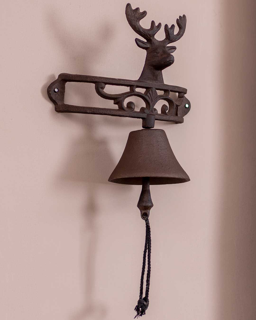 Traditional reindeer cast iron bell, wall-mountable with a vintage bronze finish.