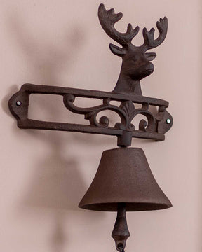 Vintage reindeer design on a cast iron bell, suitable for outdoor or indoor wall decor.