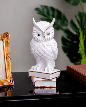 White Owl Figurine Poised on Books