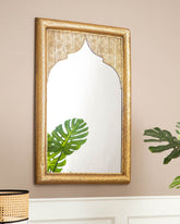 Equator Wall Mirror showcasing intricate gold detailing on the frame, perfect for elegant interiors.