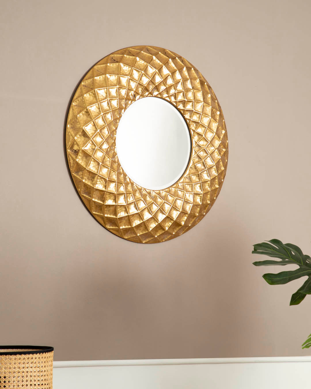 Fractal wall mirror with a geometric gold frame creating a dynamic look.