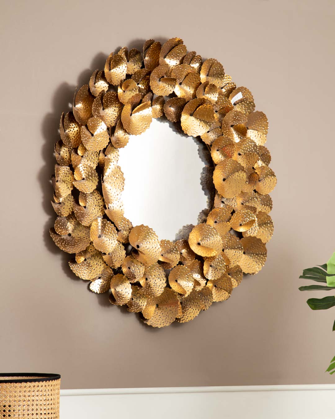 Nature's Shine Metal Leaf-Embellished Mirror hanging on wall - frontal view.