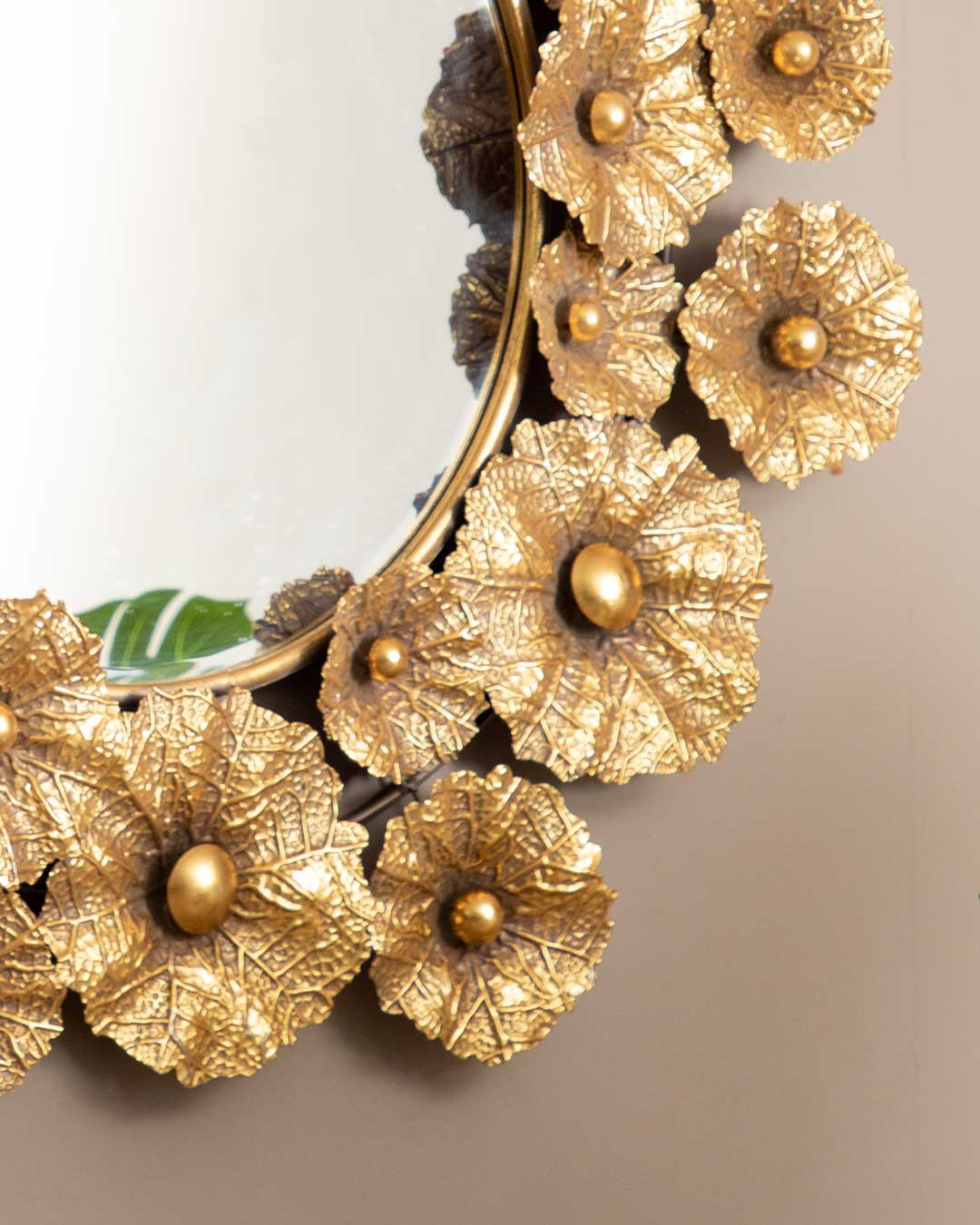 Artistic Leafy Radiance metal mirror with leaf patterns, perfect for contemporary decor.