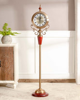 Elegant 'Seville' floor clock with decorative red stand and vintage clock face for classic interiors.