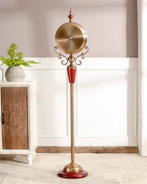 Regal 'Seville' floor-standing clock with intricate gold details and red body, a statement piece for traditional decor.