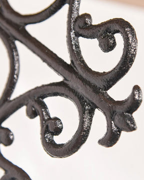 Decorative shelf bracket cast iron detailing.