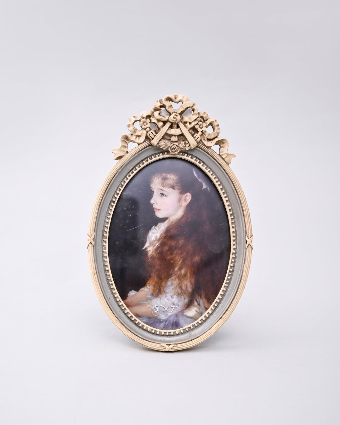 Antique style oval photo frame with decorative detailing