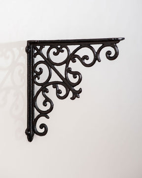 Decorative 'Opulent' cast iron shelf brackets with a classic black finish for stylish wall shelving.