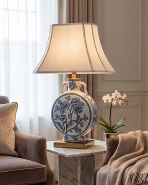 Decorative table lamp with blue and white floral design  