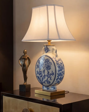 Decorative table lamp with blue and white floral design  