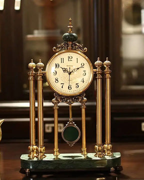 Ornate 'Villa Vista' vintage mantle clock with a pendulum and Roman numerals on a polished green marble base. 