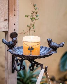 Charming cast iron bird feeder wall bracket with two birds, perfect for outdoor garden decor.