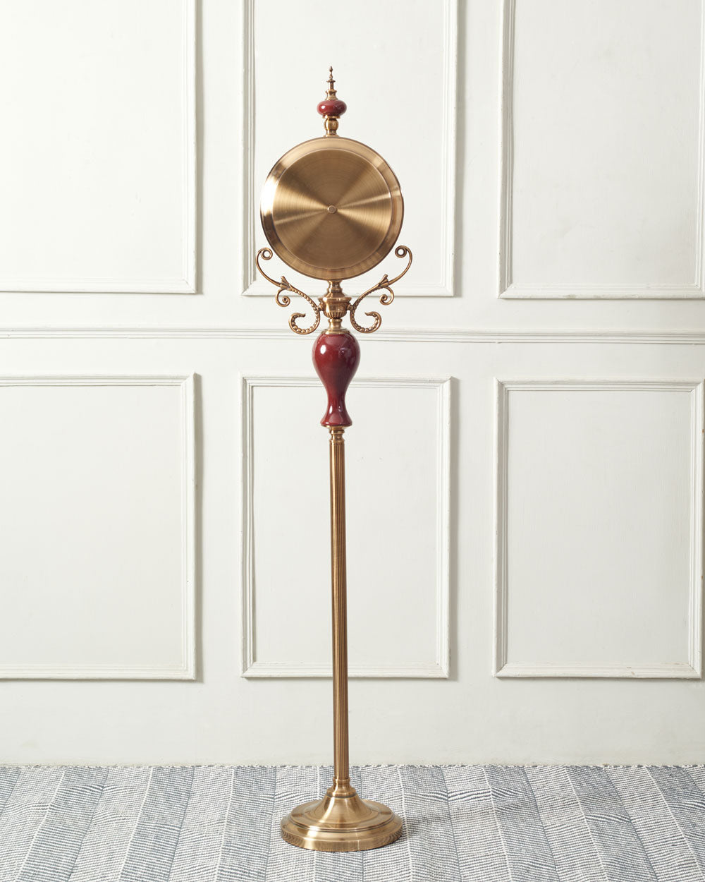Majestic 'Seville' gold floor clock with a red accent, enhancing the ambiance of upscale living spaces.